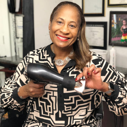 Watch as a professional hairdresser uses the SnozzlePro nozzle adapter for a secure fit on a hair dryer concentrator nozzle, enhancing styling efficiency.